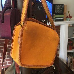 Vintage leather handbag with blanket stitch trim